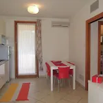 Апартаменты Modern Three Flat With Pool Бибионе
